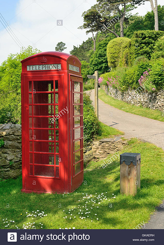 an-empty-red-telephone-box-beside-a-country-lane-in-a-remote-location-GKAERH.jpg